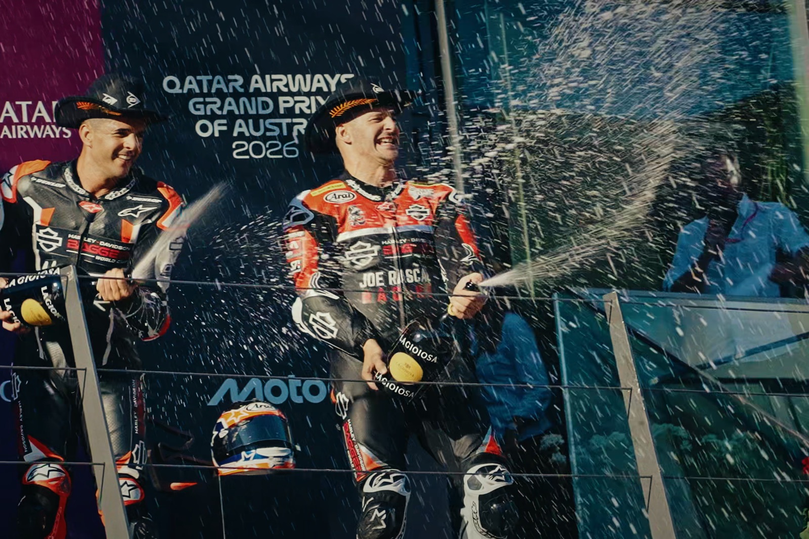 James spraying champagne on the podium in Austria